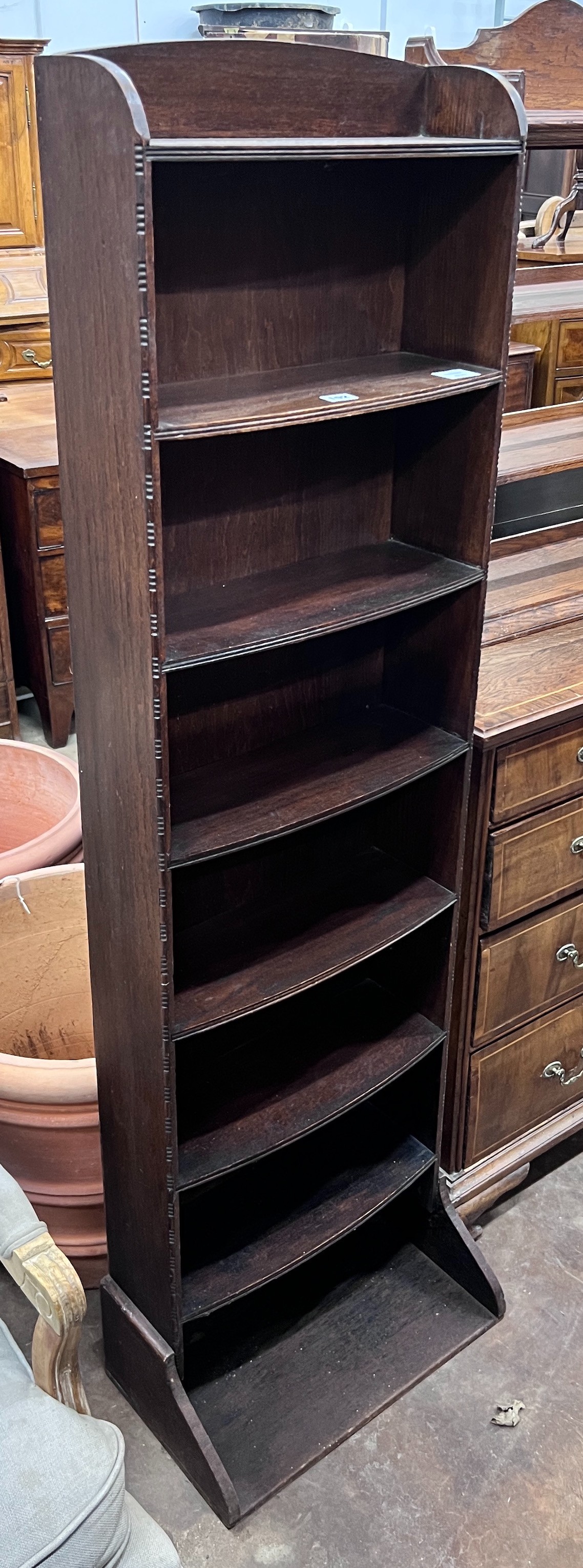A 1920's oak narrow eight shelf open bookcase, width 49cm, depth 30cm, height 161cm *Please note the sale commences at 9am.